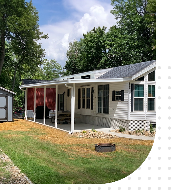 A house with a porch and patio in the back yard.